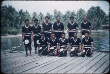 Hekaha crew at Mapamoiwa wharf (Native Hospital in background) : Mapamoiwa Station, D'Entrecasteaux Islands, Papua New Guinea, 1956-1959 / Terence and Margaret Spencer