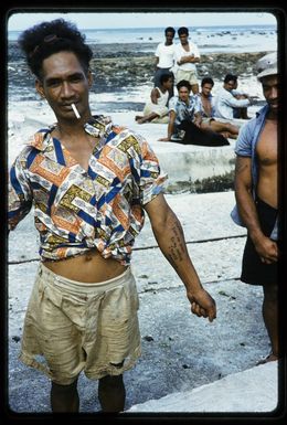 Mangaian islander displaying his tattooed message 'Take me back to my island Mangaia', Mangaia, Cook Islands