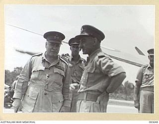 AITAPE, NEW GUINEA. 1944-11-29. GENERAL SIR THOMAS A BLAMEY, COMMANDER- IN- CHIEF, ALLIED LAND FORCES, SOUTH WEST PACIFIC AREA, (1), WITH COLONEL J H RASMUSSEN, DIRECTOR- GENERAL OF PUBLIC ..