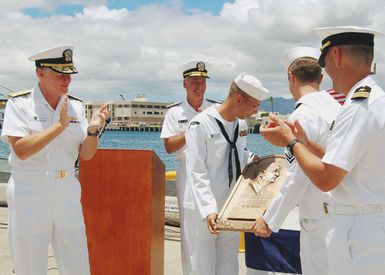 060815-N-9486C-001 (Aug. 15, 2006)US Navy (USN) Adm. Gary Roughead (left), Commander, US Pacific Fleet, and USN Rear Adm. Joseph Walsh (center back), Commander, Submarine Force US Pacific Fleet, present the Arleigh Burke Fleet Trophy to the crew of USN Los Angeles Class Attack Submarine USS COLUMBIA (SSN 771) in a ceremony onboard Naval Station (NS) Pearl Harbor, Hawaii (HI). The trophy is presented annually to the ship or squadron that is considered the most improved in the USN Atlantic and Pacific Fleets.U.S. Navy photo by Mass Communication SPECIALIST First Class Cynthia Clark (RELEASED)