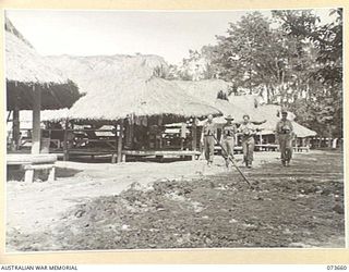 NARAKAPOR, NEAR NADZAB, NEW GUINEA. 1944-05-27. THE GENERAL VIEW OF THE MEN'S LINES AT THE 6TH FARM COMPANY, AUSTRALIAN ARMY SERVICE CORPS. COMFORTABLE ACCOMMODATION IS PROVIDED WITH FOUR MEN TO ..