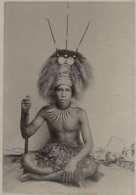 A Manaia, son of a Samoan chief wearing a tuiga head dress, Samoa, approximately 1895 / Thomas Andrew