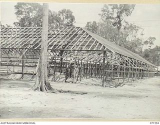 TOROKINA AREA, BOUGAINVILLE ISLAND. 1944-12-01. A LARGE BUILDING IN COURSE OF CONSTRUCTION AT HEADQUARTERS, 4TH BASE SUB AREA. THIS BUILDING WILL CONTAIN THE OFFICE ACCOMMODATION FOR ALL BRANCHES ..
