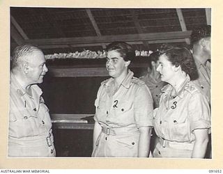 LAE, NEW GUINEA. 1945-05-11. GENERAL SIR THOMAS A. BLAMEY, COMMANDER-IN-CHIEF, ALLIED LAND FORCES, SOUTH WEST PACIFIC AREA (1), TALKING WITH CAPTAIN M.W. HORNSBY, COMMANDANT AUSTRALIAN WOMEN'S ARMY ..