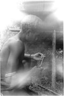 Young man with two armbands, holding piece of meat