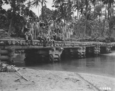 Group portrait of World War 2 NZEF IP Engineers standing on Saveke Bridge, Mono Island, Solomon Islands