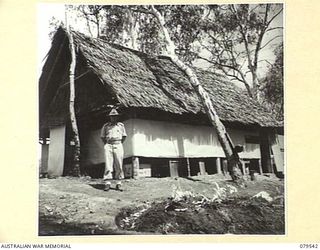 ORO BAY, NEW GUINEA. 1943-07. NX35096 LIEUTENANT-COLONEL E.C. PARKER, OBE, COMMANDING OFFICER, 10TH FIELD AMBULANCE, STANDING OUTSIDE THE COMBINED, REGIMENTAL OFFICE, MEDICAL RECORDS SECTION, PAY ..