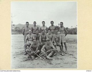 TOROKINA, BOUGAINVILLE ISLAND. 1945-01-13. THE HOCKEY TEAM OF THE ROYAL NEW ZEALAND AIR FORCE WHICH PLAYED A TEAM FROM HEADQUARTERS, 2ND AUSTRALIAN CORPS ON THE PIVA AIRSTRIP