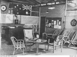 Goodenough Island, D'Entrecasteaux Islands, Papua, 1944. The Officers' Ante-room in the Communal House at the Headquarters of No. 71 Wing RAAF. The room, a place where officers could relax, is ..