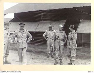 TOROKINA, BOUGAINVILLE. 1945-04-11. SENATOR J.M. FRASER, ACTING MINISTER FOR THE ARMY (3), AND SENIOR OFFICERS OUTSIDE THE AMENITIES HUT AT 2/1 GENERAL HOSPITAL DURING HIS VISIT TO THE AREA. ..