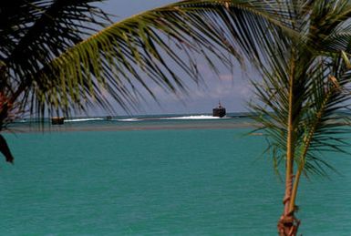 A Los Angeles class nuclear-powered attack submarine USS HELENA (SSN-725) heads into the channel as it arrives for a visit to Naval Station, Pearl Harbor.