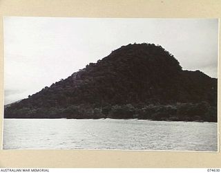 BASAMA LAE AREA, NEW GUINEA. 1944-07-13. THE SUGARLOAF MOUNTAINS IN THE HUON GULF FROM WHERE AUSTRALIAN NEW GUINEA ADMINISTRATIVE UNIT AND OTHER ALLIED AGENTS KEPT WATCH ON JAPANESE AIR AND SEA ..