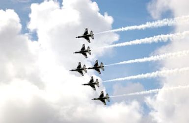 The U.S. Air Force Thunderbirds Aerial Demonstration Team F-16C Fighting Falcon aircraft perform during the Open House Air Show, Sept. 12, 2004, at Andersen Air Force Base, Guam. (U.S. Air Force PHOTO by AIRMAN 1ST Class Kristin Ruleau). (Released)