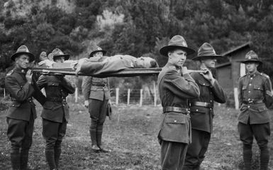 Soldiers carrying a patient on a stretcher