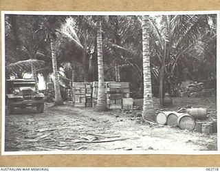 SIALUM, NEW GUINEA. 1944-01-05. A SECTION OF ONE OF THE 9TH AUSTRALIAN DIVISION SUPPLY DUMPS IN A COCONUT PLANTATION NEAR THE BEACH