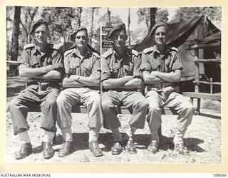 TOROKINA, BOUGAINVILLE, 1945-10-15. OFFICERS OF U HEAVY BATTERY. IDENTIFIED PERSONNEL ARE:- MAJOR J.I. MCKENNA (1); CAPTAIN R.A. HITCHENS (2); LIEUTENANT D.P. MANNING (3); LIEUTENANT W.P. MCKEE (4)