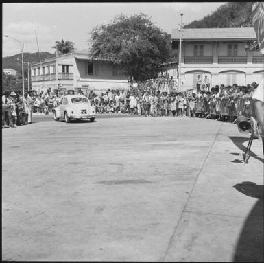 Spectators standing along the sideline during the 1st Safari Calédonien racing event, New Caledonia, 1967, 1 / Michael Terry