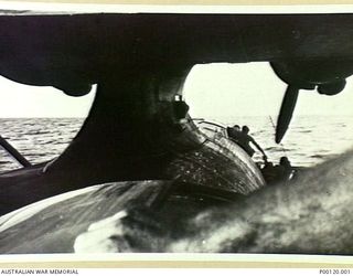 NEAR WEWAK, NEW GUINEA, 1944-11-10. A RAAF CATALINA RESCUING FIVE AMERICAN AIRMEN FROM A 5TH BOMBER COMMAND COMBAT REPLACEMENT AND TRAINING CENTRE B25 AIRCRAFT WHICH WAS DOWNED FOUR MILES FROM CAPE ..