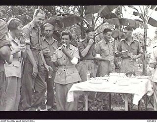 LAE, NEW GUINEA, 1945-12-07. PERSONNEL OF SUPPLY AND TRANSPORT UNIT, FIRST ARMY, ENJOYING THE CHRISTMAS GARDEN PARTY ARRANGED BY OFFICERS OF THE UNIT AS A CHRISTMAS GESTURE TO THEIR STAFF