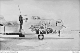 NADZAB, MARKHAM VALLEY, NEW GUINEA. 1944-02. UNITED STATES 5TH AIR FORCE (HEAVY BOMBER GROUP) WITH WHICH UNIT NO 1 WIRELESS UNIT RAAF WAS WORKING AT THAT TIME. B 24 LIBERATOR HEAVY BOMBER OF THE US ..