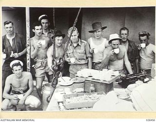 OFF PORT MORESBY, PAPUA. 1942-08-30. SOME OF THE CREW OF M.V. MALAITA, WHO AFTER THE SHIP HAD BEEN TORPEDOED BY AN ENEMY SUBMARINE OFF PORT MORESBY, WERE SAFELY TAKEN OFF AND LATER RETURNED TO HELP ..