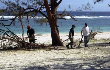 Members of Team Andersen, band together to clean Terague Beach on Andersen Air Force Base (AFB), Guam, after super-typhoon Pongsona struck the island