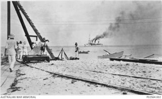 Fanning Island. 7 September 1914. Staff of the Pacific Cable Board and some German Marines from the German ship Nurnberg standing on the beach of Fanning Island, after the communications cable had ..