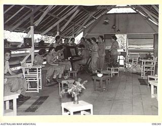 LAE, NEW GUINEA. 1945-10-10. THE INTERIOR OF THE YWCA HUT AT THE AUSTRALIAN WOMEN'S ARMY SERVICE BARRACKS