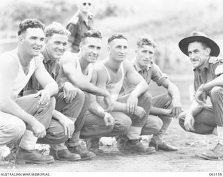 Ex-Victorian League and Association footballers in attendance at the 15th Infantry Brigade Gymkhana. Identified left to right are: VX139608 Lance Corporal James Patrick "Shane" McGrath (Melbourne ..
