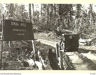 FINSCHHAFEN AREA, NEW GUINEA. 1944-03-13. ONE OF MANY BATTLE SIGNS IN THE FINSCHHAFEN AREA NAMED XMAS HILL AFTER LEARNING THAT THE 2/32ND INFANTRY BATTALION WOULD BE ON THIS HIGH FEATURE DURING THE ..