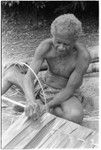 Geleniu sews palm leaf thatch panel