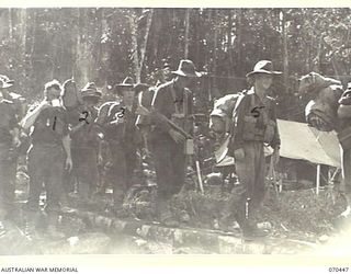 FARIA RIVER, NEW GUINEA, 1944-02-15. MEMBERS OF "C" COMPANY, 57TH/60TH INFANTRY BATTALION ON THE MARCH UP THE FARIA RIVER TO THE PROTHERO FEATURES IN THE FINISTERRE RANGE TO RELIEVE THE 2/9TH ..