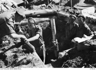 TSIMBA RIDGE, BOUGAINVILLE ISLAND. 1945-02-06. THE 4.2" MORTARS OF THE 101ST BRIGADE SUPPORT COMPANY IN OPERATION DURING THE ATTACK ON ENEMY POSITIONS BY THE 31/51ST INFANTRY BATTALION. IDENTIFIED ..