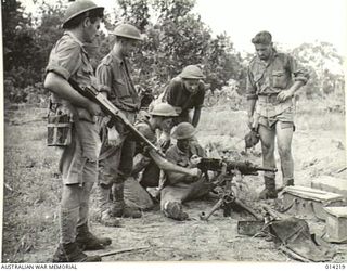 1943-01-25. PAPUA. NEARING THE END OF THE PAPUAN CAMPAIGN AGAINST JAPAN. AUSTRALIAN MACHINE GUNNERS TRY OUT A CAPTURED JAPANESE HEAVY MACHINE, CAPTURED IN THE FIGHTING AT SANANANDA. THE JAP CREW OF ..