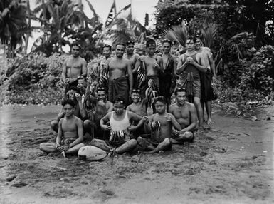 [Group of Pacific Island men holding fish]