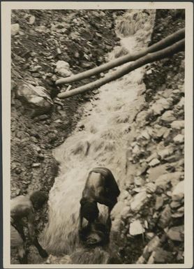 Two men panning for gold, Bulolo River, New Guinea, 1933 / Sarah Chinnery