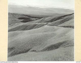 WAU LAE ROAD, NEW GUINEA, 1944-03-03. THE MARKHAM VALLEY FROM THE ROADWAY 79 MILES FROM WAU