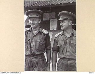 BORAM, NEW GUINEA. 1945-11-16. LIEUTENANT R.D. RUMBOLD, OFFICER COMMANDING 3 BASE SUB AREA, AUSTRALIAN ARMY CANTEENS SERVICE (1) AND LIEUTENANT G.H. MORRIS, SECOND IN COMMAND (2)