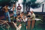 People at a lagoon side party in Papeete