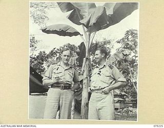 LAE, NEW GUINEA. 1944-08-07. VX20306 CHAPLAIN GENERAL C.L. RILEY, CBE, VD, CHURCH OF ENGLAND BISHOP OF BENDIGO, VICTORIA, HEADQUARTERS, NEW GUINEA FORCE (1) AND NX234 CHAPLAIN F.A. HULME-MOIR, ..