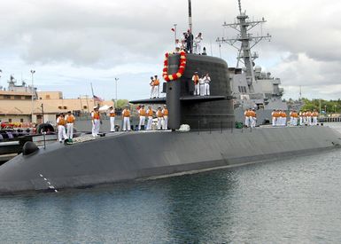 Japanese Maritime Self-Defense Force (MSDF) Sailors aboard the Japanese Defense Ship (JDS) Oyashio Class Submarine Narushio (SS 595) prepare to disembark the submarine as it arrives for a port call in Pearl Harbor, Hawaii. Japan is one of several countries participating in this year's 2004 Rim of the Pacific (RIMPAC) exercise. RIMPAC is the largest international maritime exercise in the waters around the Hawaiian Islands. This years exercise includes seven participating nations: Australia, Canada, Chile, Japan, South Korea, the United Kingdom and the United States. RIMPAC enhances the tactical proficiency of participating units in a wide array of combined operations at sea, while...