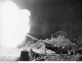 HAWAIN, WEWAK AREA, NEW GUINEA. 1945-05-08. NO. 1 GUN, 2/3 FIELD REGIMENT, IN ACTION. THESE "LONG TOM" 155MM GUNS ARE IN POSITION FOR THE FINAL ASSAULT AGAINST WEWAK