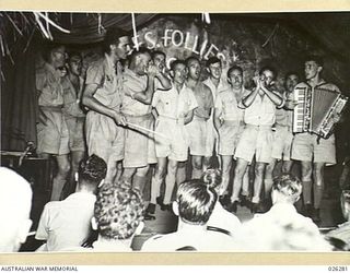 PAPUA. 1942-08-19. SOME OF THE PERFORMERS AT A COMMUNITY SINGING CONCERT HELD AT PORT MORESBY BY NO.4 FIGHTER SECTION RAAF