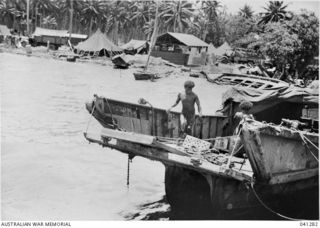 Milne Bay, Papua. 1943. Japanese invasion barges destroyed by fighter aircraft of the Royal Australian Air Force during the Japanese landing in 1942-08