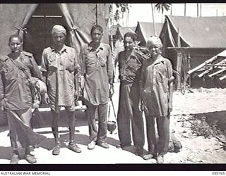 BORAM BEACH, NEW GUINEA, 1945-10-14. FOUR OF THE ELEVEN SOLDIERS LIBERATED FROM THE JAPANESE IN THE SEPIK RIVER AREA NOW RECEIVING TREATMENT AT 2/15TH FIELD AMBULANCE. THEY ARE SUFFERING FROM ..