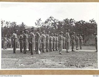 17 MILE, PORT MORESBY AREA, 1943-12-24. A COMPANY OF THE 10TH AUSTRALIAN ADVANCED ORDNANCE DEPOT ON PARADE FOR AN INSPECTION BY VX247 BRIGADIER C. A. STINSON, DEPUTY DIRECTOR OF ORDNANCE SERVICES, ..