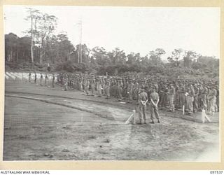 TOROKINA, BOUGAINVILLE. 1945-10-05. 6. THE COMMEMORATIVE SERVICE HELD BY TROOPS OF 24 INFANTRY BATTALION AT THE TOROKINA WAR CEMETERY IN MEMORY OF MEN WHO DIED IN THE BOUGAINVILLE OPERATION