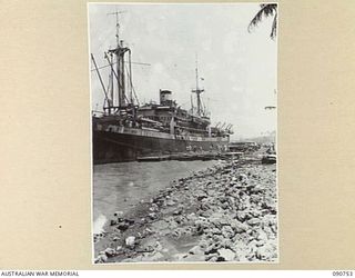 MILNE BAY, NEW GUINEA. 1942-09-14. SS KREMER IN THE PROCESS OF UNLOADING MEN AND EQUIPMENT AT PONTOON WHARF