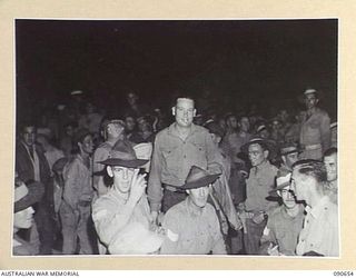 TOROKINA, BOUGAINVILLE. 1945-04-14. A SECTION OF THE CROWD THAT SAW THE PERFORMANCE, AT BOSELY FIELD, BY THE BOB DYER CONCERT PARTY. MORE THAN 10,000 SERVICEMEN AND WOMEN ATTENDED