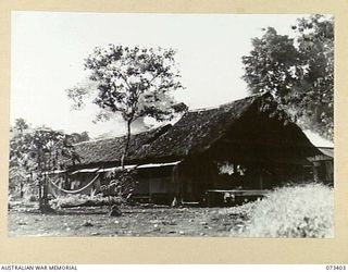 LAE, NEW GUINEA. 1944-05-24. THE MESS AND LIVING QUARTERS OF THE SUPPLY AND STORES SECTION, AUSTRALIAN NEW GUINEA ADMINISTRATIVE UNIT